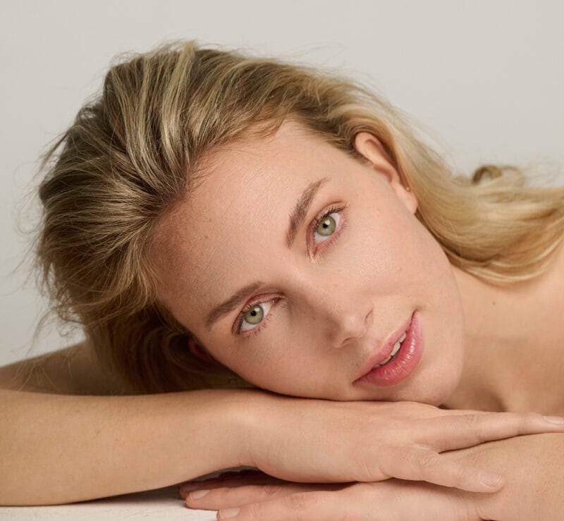 Professional beauty specialist using Observ 320 for facial skin diagnostics